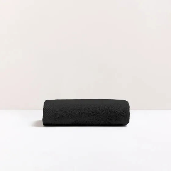 Luxe antraciet Florence handdoek van 100% GOTS-katoen, 600 g/m², hoge kwaliteit, zacht en absorberend.