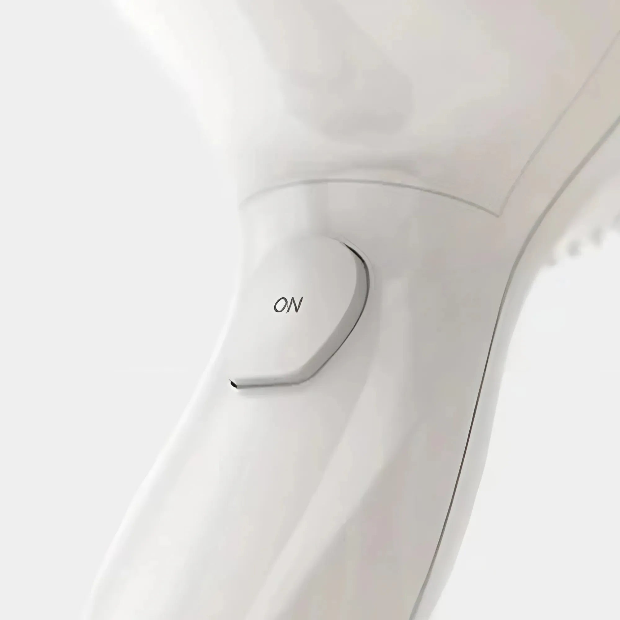 Close-up van de aan-/uitschakelaar van de Valera Swiss Bébé föhn